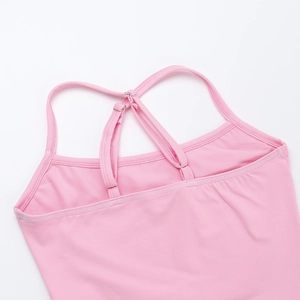 Detail view of pink bodycon jumpsuit featuring adjustable criss-cross spaghetti straps