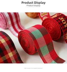 Macro shot of faux linen Christmas ribbons with buffalo plaid patterns and joy gold text