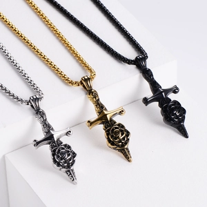 Sword and rose pendant necklaces in gold, silver, and black on geometric stands