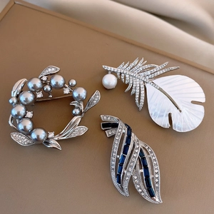 Exquisite 14k gold plated pearl flower brooches with shell inlay and blue crystal details