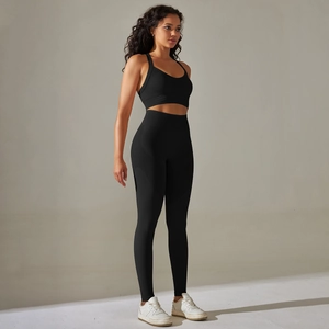 Detail of black seamless yoga set showing breathable mesh knit and high-waist sports leggings