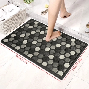 Detailed view of gray geometric diatom mud mat with 80x50cm dimensions and anti-slip base