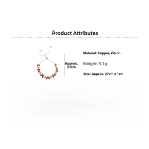 Detail view of gold-plated copper bracelet with butterfly-shaped red and white zircon stones