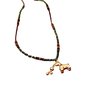 New Chinese style tiger eye glass necklace with a hammered gold pony pendant