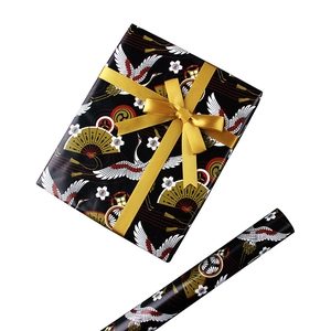 Japanese style wrapping paper with cranes and fans, featuring a gift box with golden ribbon