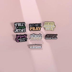 Set of 7 religious enamel pins with inspirational quotes on a soft pink background