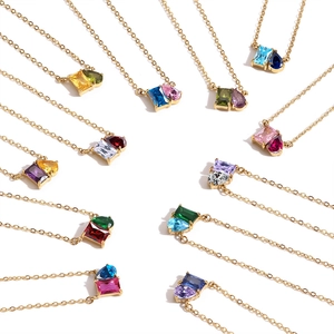 Detailed circular layout of 14k gold teardrop and rectangle crystal pendant necklaces