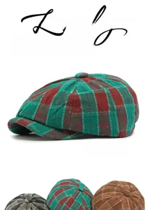 Close-up of vintage plaid newsboy cap in green and red tweed with textured wool finish