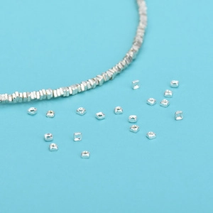 Macro detail of S925 sterling silver square spacer beads for DIY jewelry making