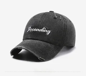 Detailed side view of distressed charcoal denim baseball cap with Ascending embroidery