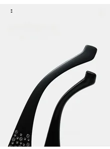 Detail view of curved black sunglasses legs with sparkling rhinestone inlay and ergonomic design