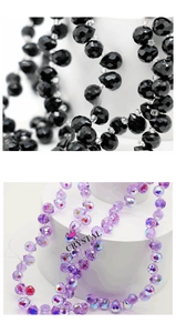 Macro detail of faceted teardrop crystal beads in black and iridescent purple for DIY jewelry
