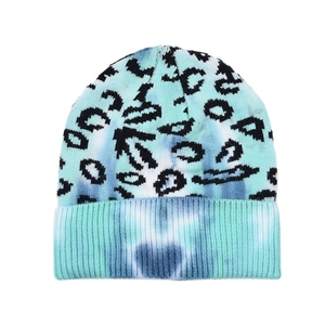 Detail of tie-dye beanie featuring leopard print and wide ribbed cuff texture
