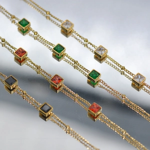 Elegant gold chain bracelet set with colorful square-cut emerald and ruby zircon stones