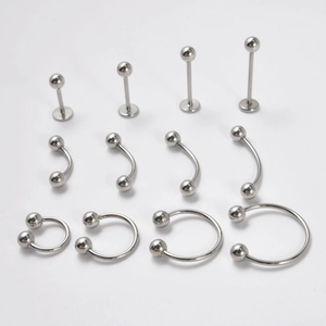 Polished stainless steel piercing set with lip studs eyebrow rings and horseshoe rings