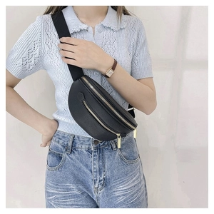 Fashionable black leather crescent belt bag for women with golden zippers and canvas strap