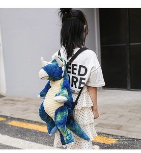 Detail of the triceratops plush backpack with textured fur and adjustable black straps
