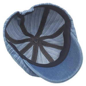 Classic blue denim newsboy cap interior view with durable black sweatband and stitching