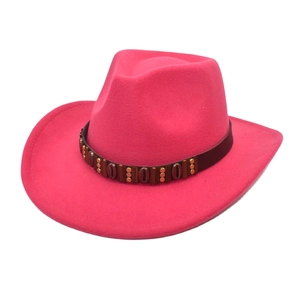 Detailed side view of rose red felt cowboy hat with brown leather rivet shell band
