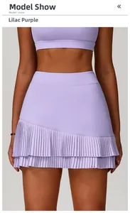Detail view of high-waist lilac purple pleated sports skirt with asymmetric tiered hem