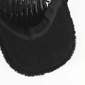 Detailed close-up of the plush faux fur brim and non-slip inner comb of this black cap
