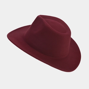 Close-up of the wine red wool felt fedora showing premium texture and structured wide brim