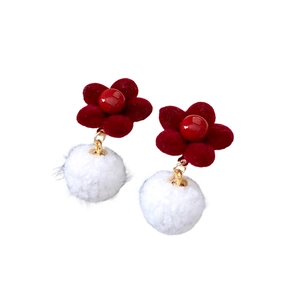 Floral stud earrings featuring deep red flocked flowers and soft white pom-pom dangles