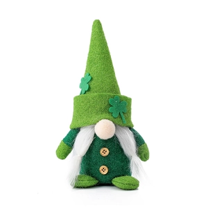 Saint Patrick’s Day green gnome with white beard and clover decoration on white background