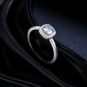 Elegant S925 silver ring with a sparkling grey moissanite on luxury black silk background