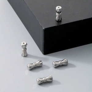 Macro detail of five silver screw clasps for pearl necklaces and jewelry making