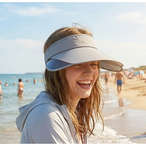 Light gray sun hat with retractable side lenses for outdoor sun protection at the beach
