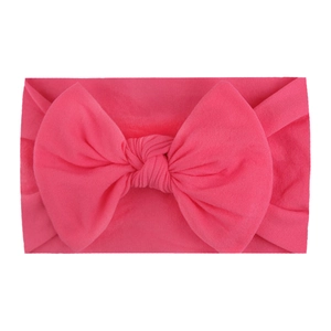 Soft nylon wide headband with a large rose pink bow for baby girls and infants