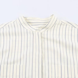 Minimalist cream and blue striped long-sleeved shirt with stand collar and hidden placket