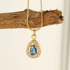 Waterdrop blue zircon pendant necklace in 18K gold stainless steel on wood branch