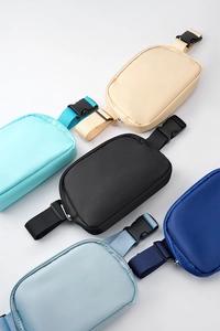 Detailed view of durable nylon waist bags in five different colors including beige and blues