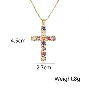 Detail of cross pendant necklace with colorful zircons measuring 4.5cm by 2.7cm