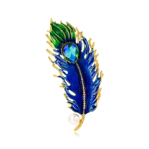 Detailed peacock feather brooch with blue enamel inlay, zirconia stones, and white pearl