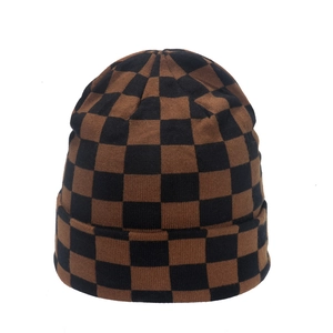 Minimalist checkerboard knit beanie in brown and black with a thick cuffed design