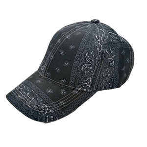 Detail of hip-hop baseball cap featuring black and white paisley bandana print pattern