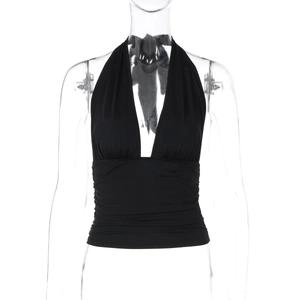 Detail of black halter neck top featuring deep V-neckline and elegant pleated texture