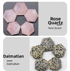 Macro detail of hexagonal cut Rose Quartz and Dalmatian stone crystal specimens