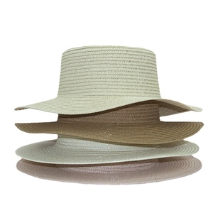 Breathable foldable straw sun hats in four colors stacked against white background