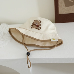 Beige baby sun hat with cute bear embroidery and adjustable chin strap for outdoors