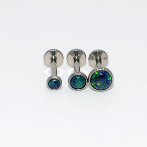 Three sizes of G23 titanium labret studs featuring turquoise opal inlay on white background