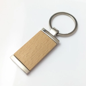 Rectangular beech wood keychain with silver metal rings and smooth natural finish