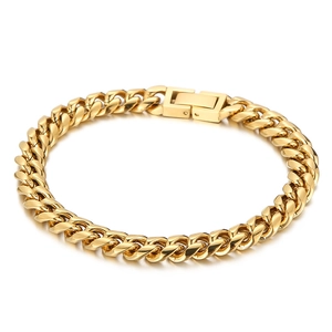 Polished gold Cuban link bracelet with flat surface and secure folding clasp on white background