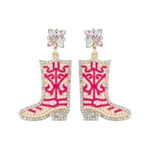 Detail of gold boot earrings with pink enamel, pearls, and sparkling rhinestones