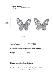 Detail view of butterfly earrings with zircon stones and dimensions 1.7cm by 2cm