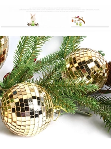 Detailed view of a golden mirrored disco ball ornament with shiny reflective surface