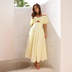 Pale yellow backless midi dress with waist cut-outs and puff sleeves for summer vacation
